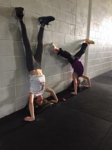 Zoe and friend doing a hand stand