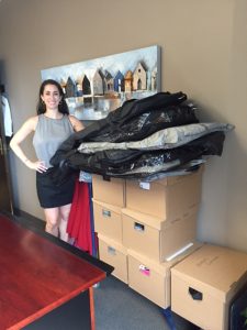 Image of Deanna Gilbert with boxes of clothes donated to Dress for Success Toronto 2016