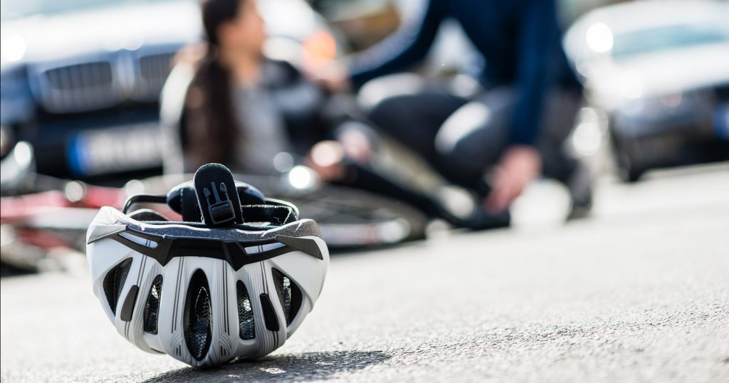 bicycle helmet on ground after an accident