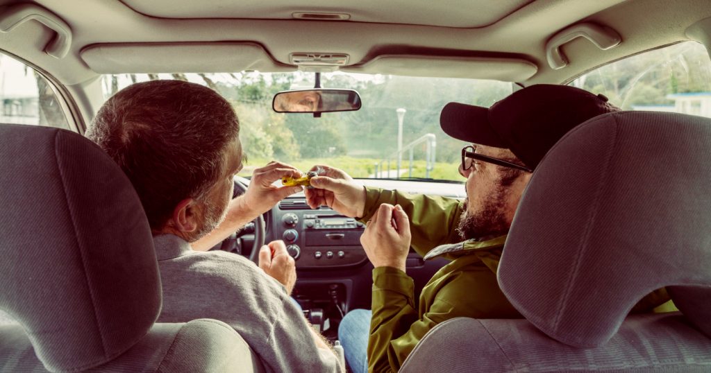 driver and passenger smoking marijuana in car