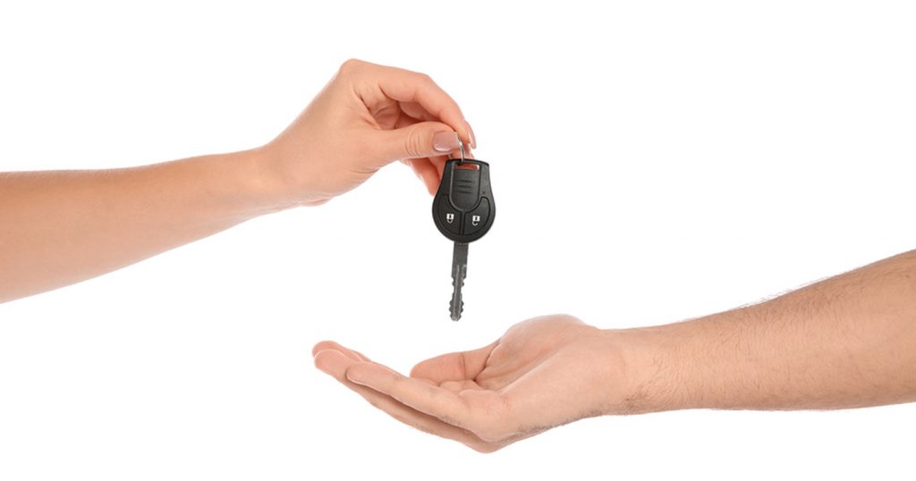 handing over car keys to someone else