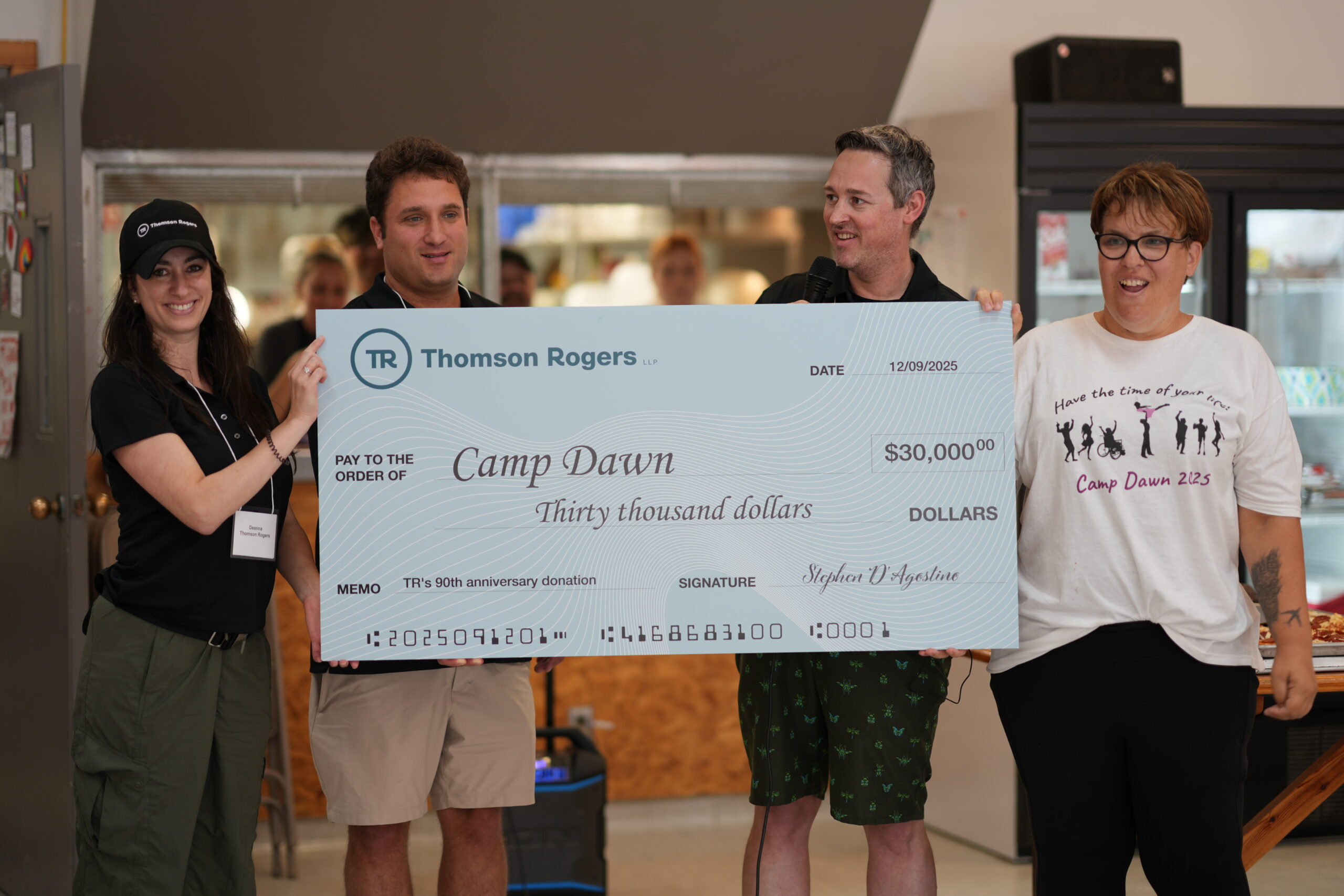 Thomson Rogers lawyers gave $30,000 cheque as a donation to Camp Dawn